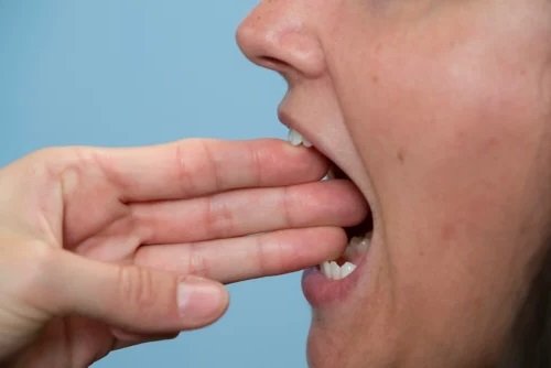 Common Symptoms of TMJ Disorders difficulty in opening and closing the mouth